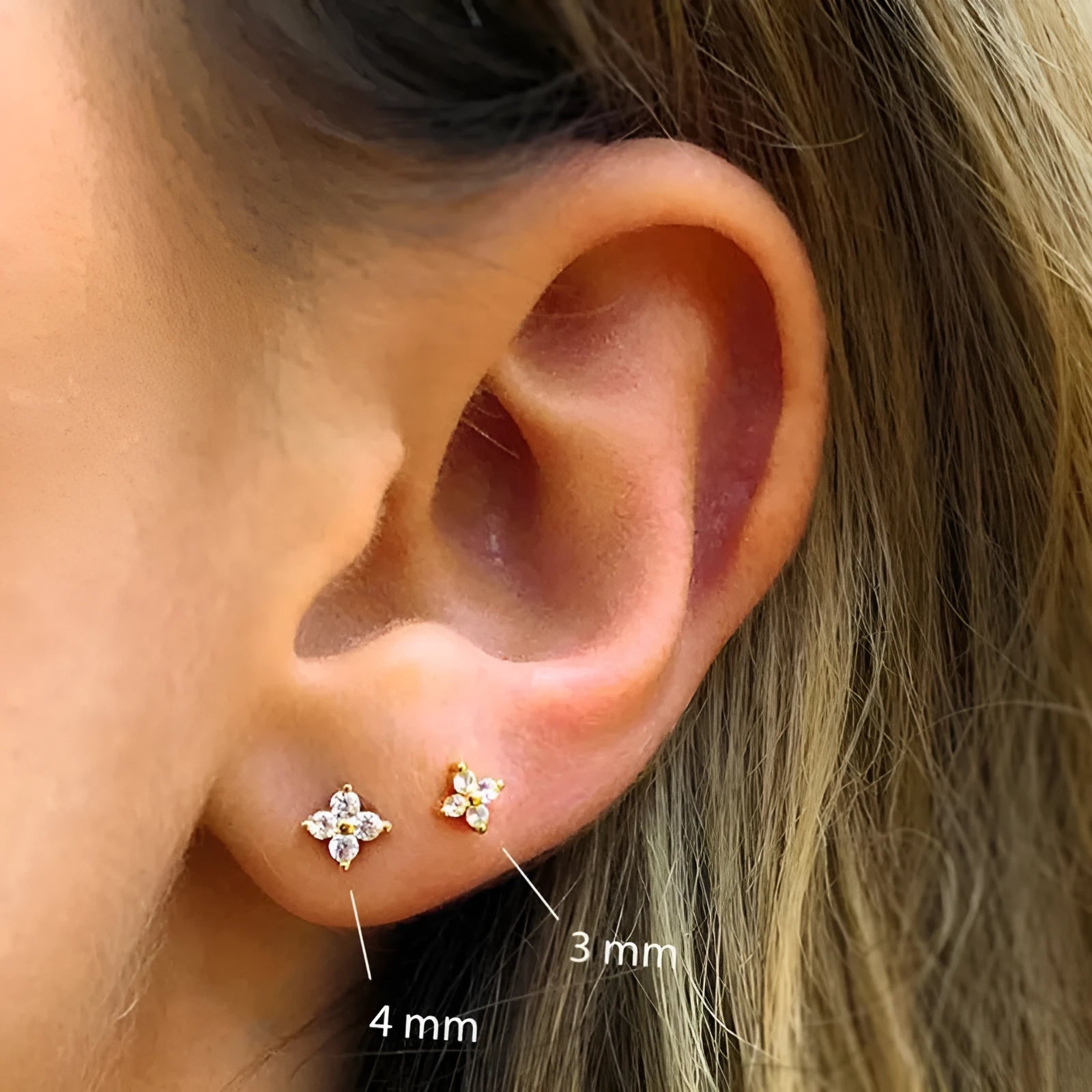 S925 sterling silver stud earrings with a geometric petal crystal flower in gold or platinum finish.