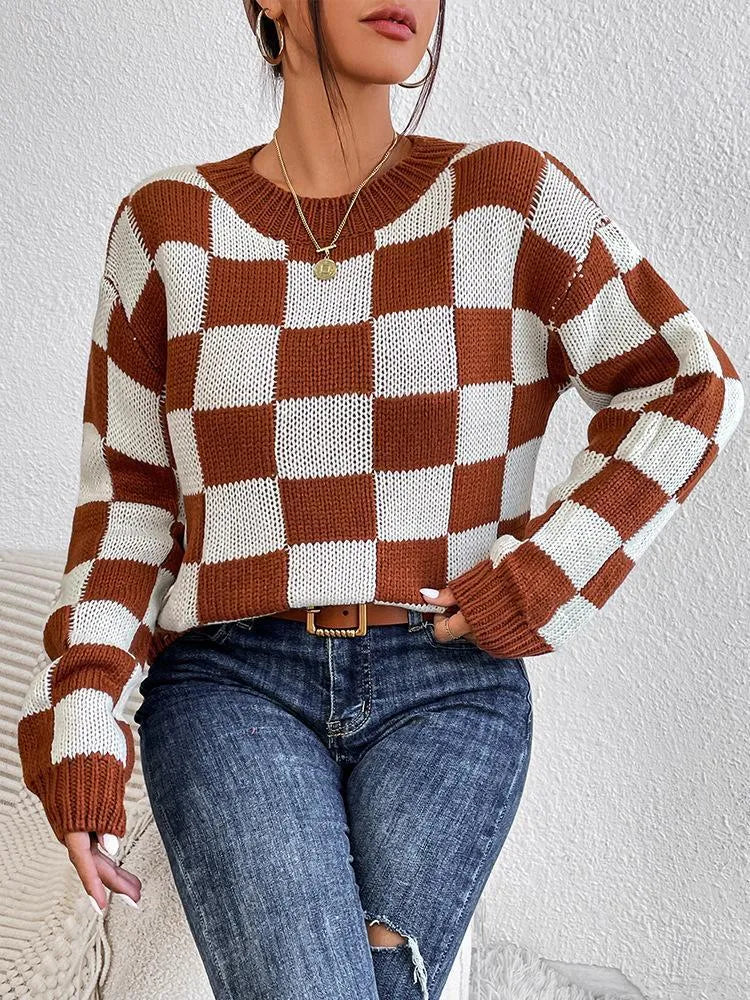 Dark brown plaid pattern acrylic pullover sweater with round neck and long sleeves on hanger