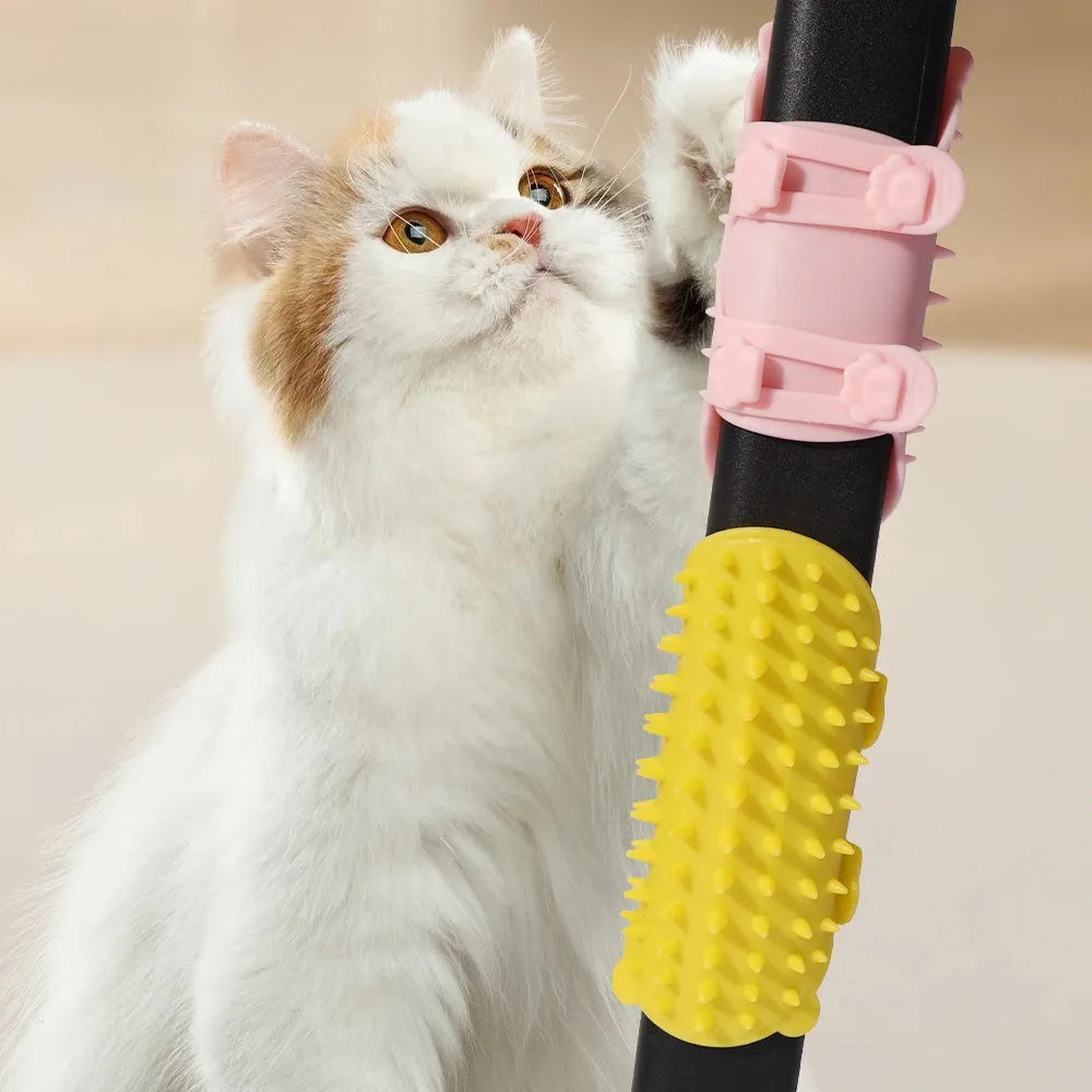 Silicone cat grooming brush with comb teeth mounted on table leg for scratching and hair removal