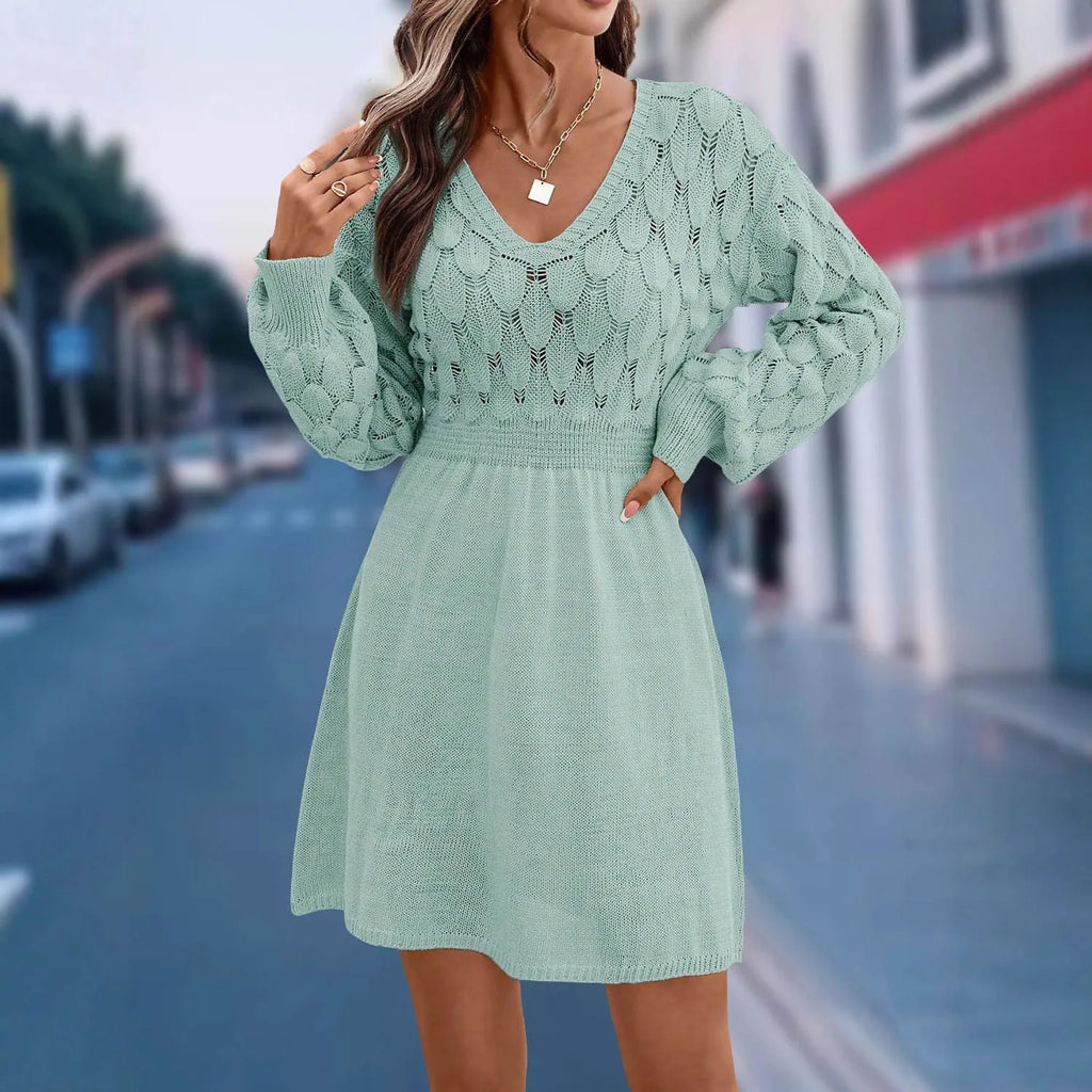 Woman wearing an apricot coloured acrylic V-neck ethnic dress with 3D patterns and a high waist.