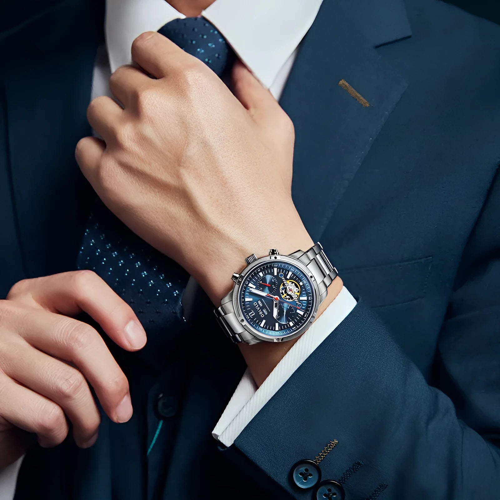 Men's multi-functional hollowed fashion watch with date display, steel strap, silver blue colour