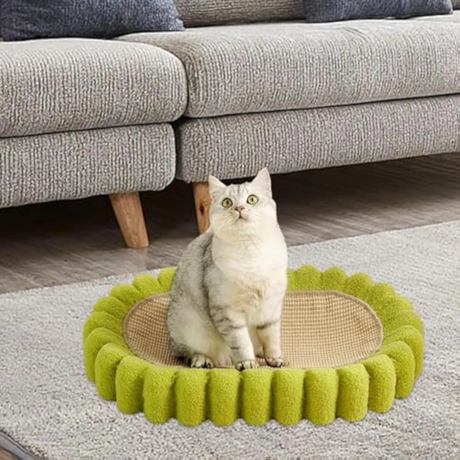 Green oval sisal cat scratch pad showing scratching surface and bowl-shaped lounging area