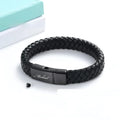 Black woven leather and stainless steel cinerary bracelet with engraving option on a gift box.