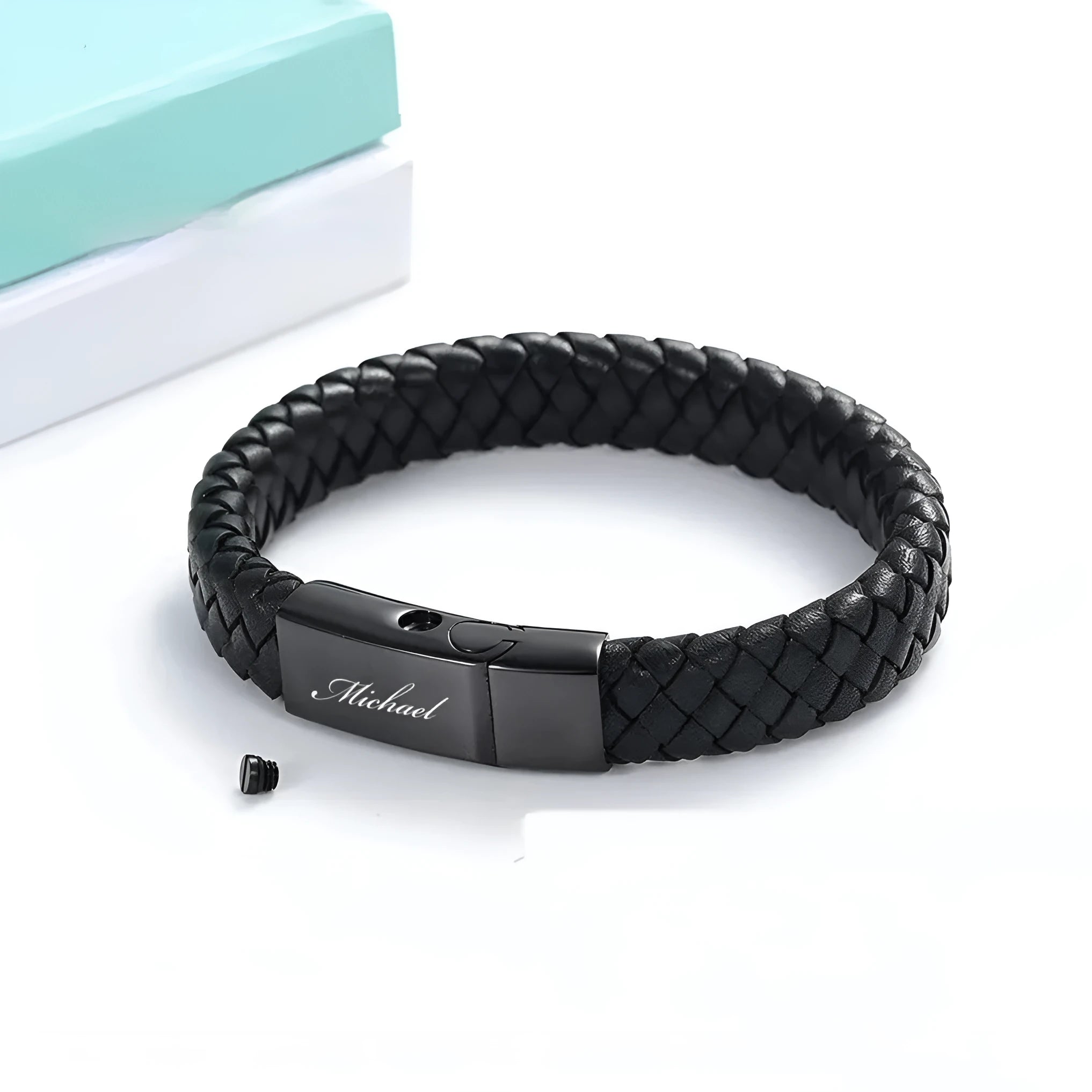 Black woven leather and stainless steel cinerary bracelet with engraving option on a gift box.