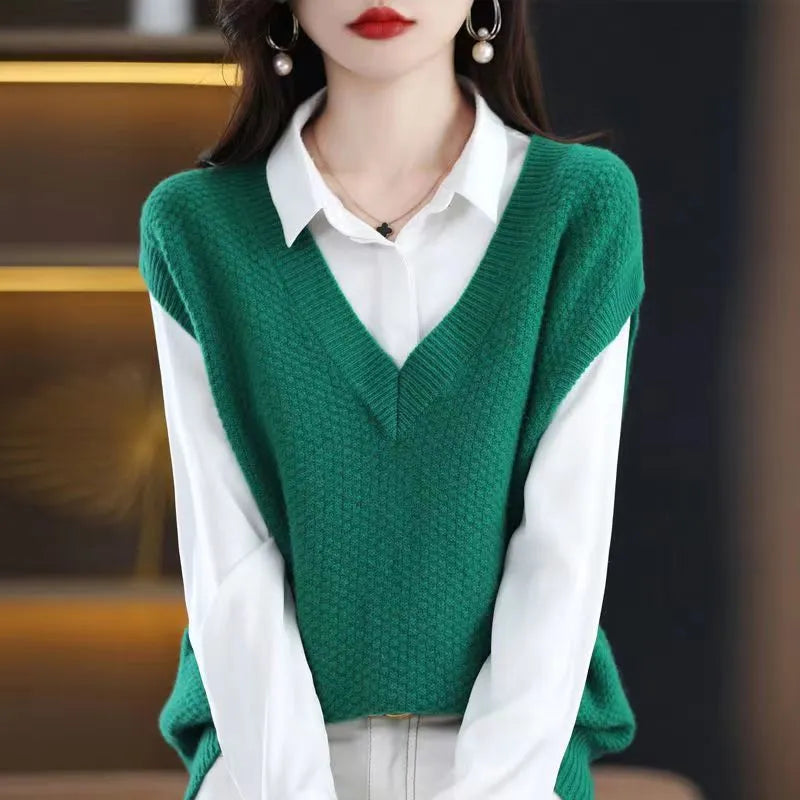 Sleeveless V-neck knitted vest with a 3D pattern, shown in one of six available colours.