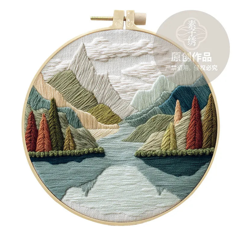 Embroidery DIY kit with landscape printed fabric, bamboo frame, thread, and needles for handmade cloth art