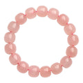 Pink natural crystal bracelet with barrel shaped beads in geometric design
