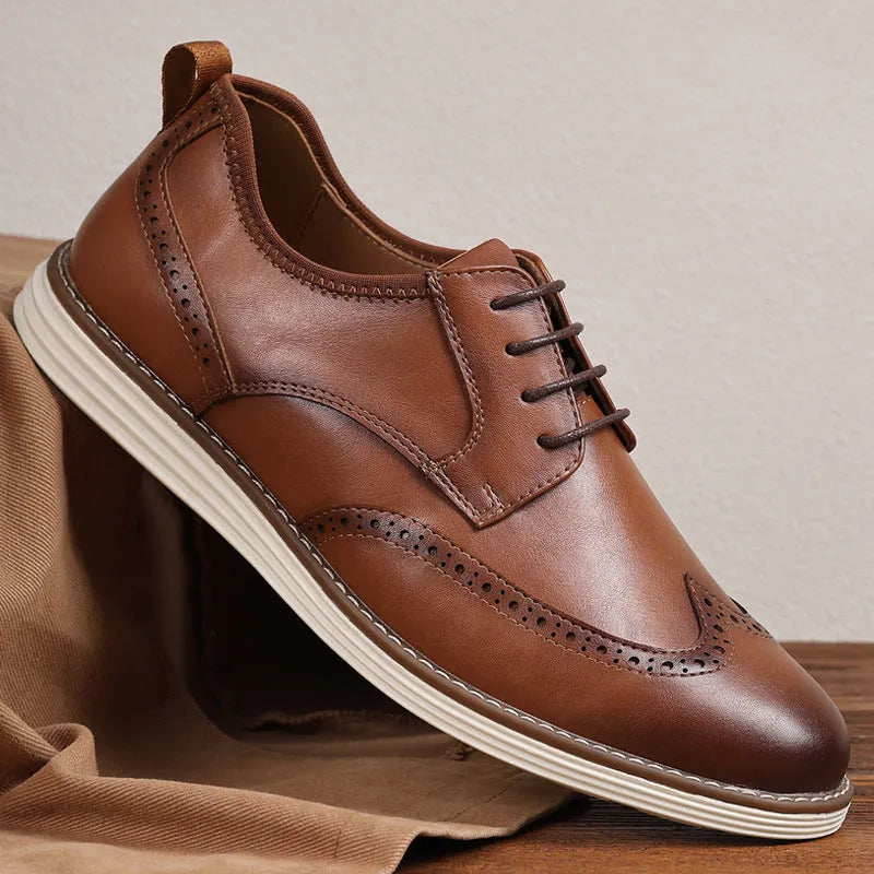 Men's black slip-on business casual shoe with round toe and carved PU upper detail on a TPR sole.