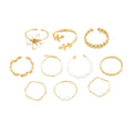 Openwork flower ring set with glossy gold finish and detailed floral pattern