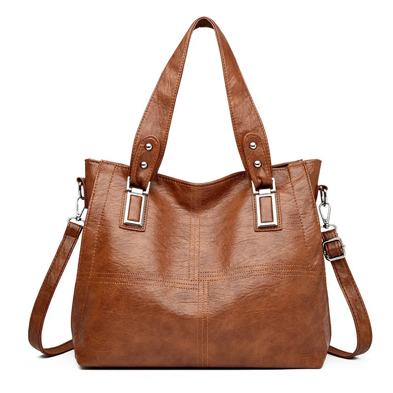 PU women's handbag in black with horizontal square shape and sewing thread details
