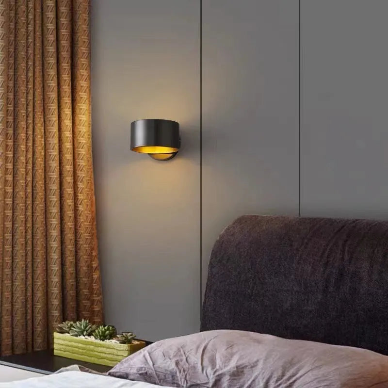 Modern minimalist wall lamp with a copper finish in black or gold colour options.