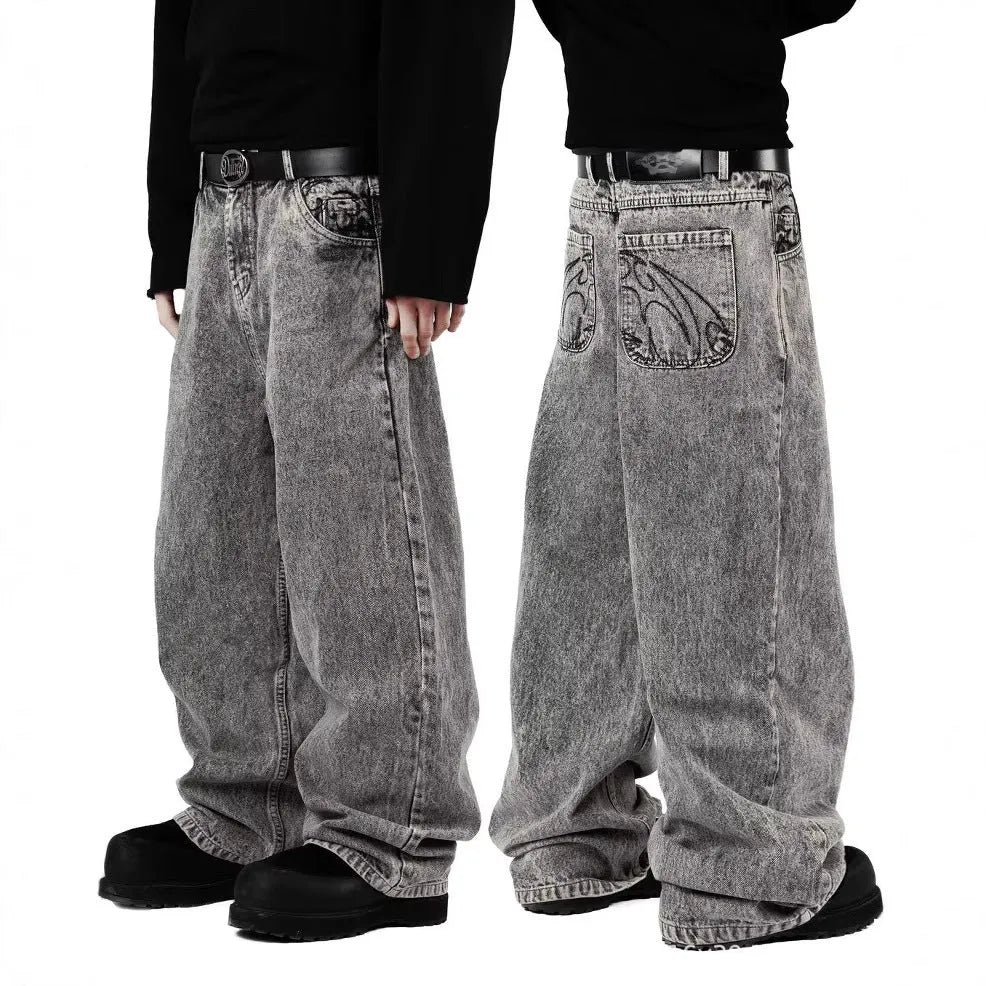 Grey loose straight-leg cotton denim trousers for men and women showing mid-waist design