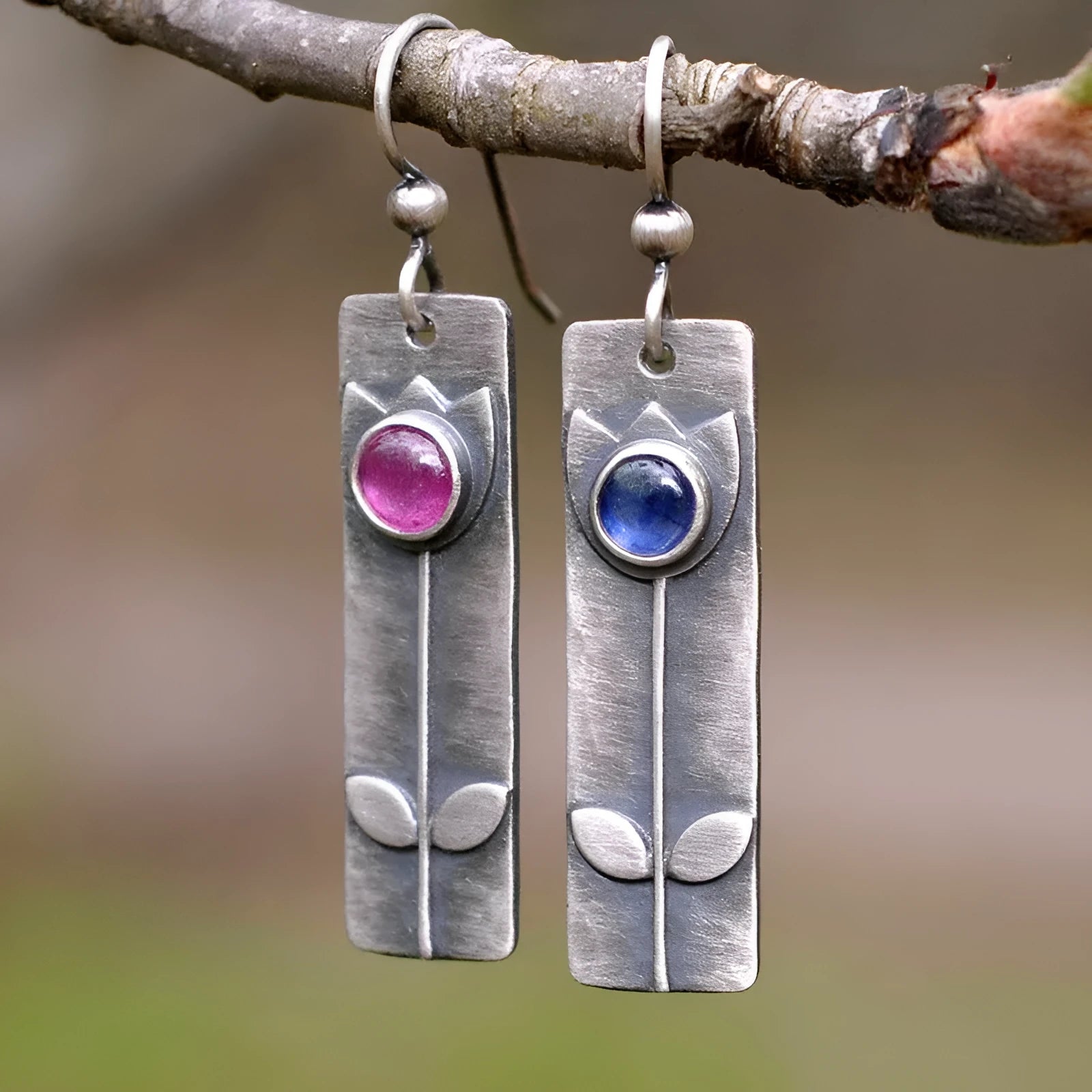 Geometric antique finish earrings with ellipse details and electroplated metal construction