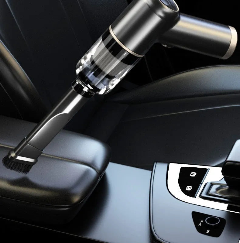 Black wireless car vacuum cleaner with multiple nozzle attachments including inflation nozzle and brush heads