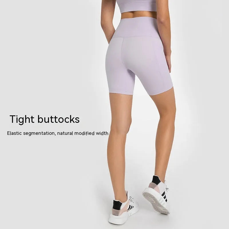 Women's tight-fitting mid-length sports shorts in a cotton blend fabric for running and fitness.