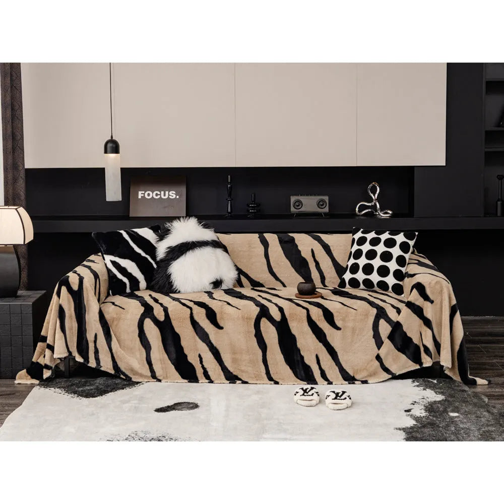 Zebra pattern flannel sofa cover with non-slip backing shown in a caramel colour.