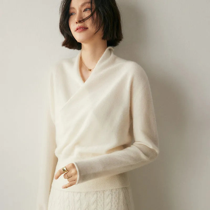 Women's solid colour cashmere V-neck cross sweater top with long sleeves in Elegant Camel, shown on a model.