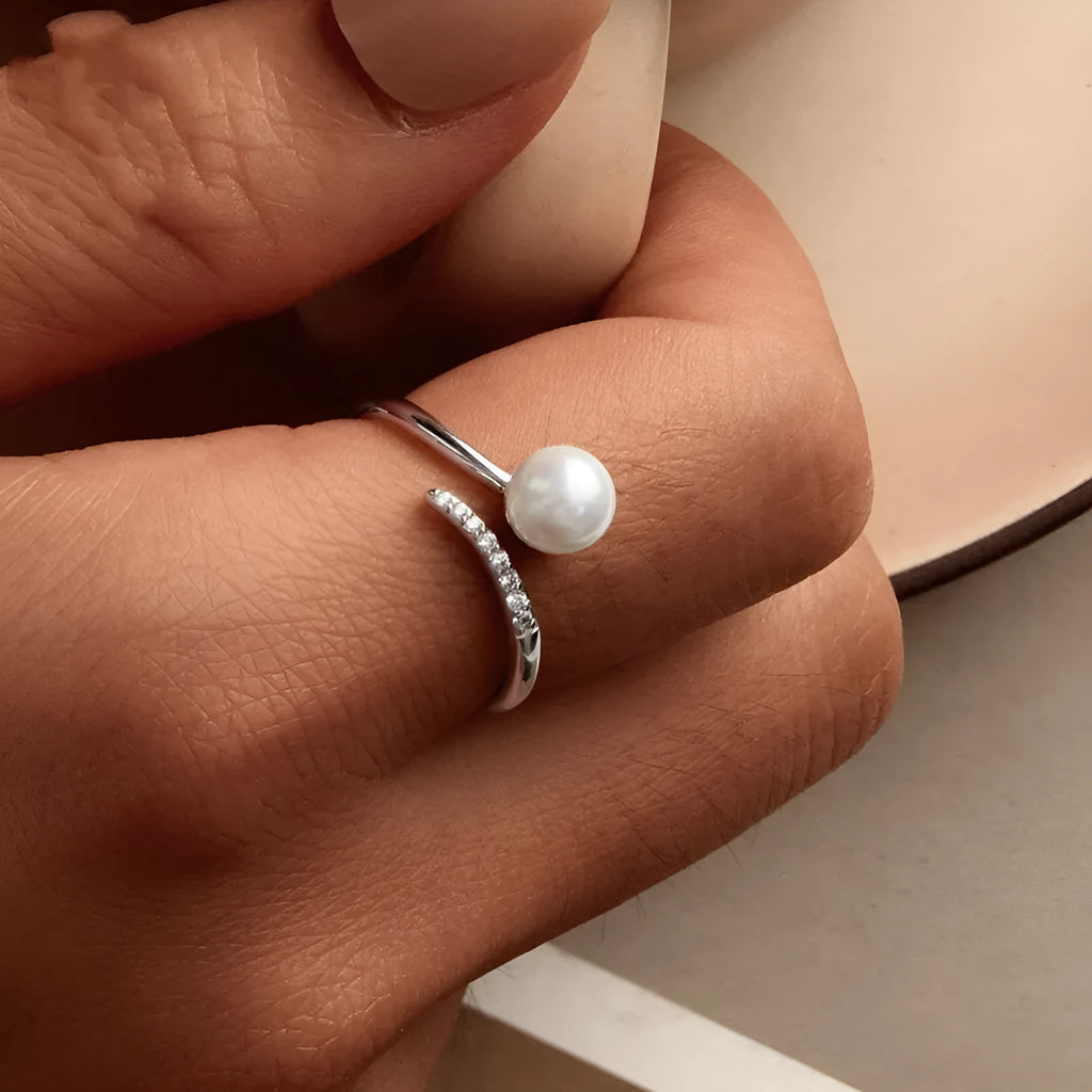 Sterling silver adjustable ring with genuine freshwater shell pearl on minimalist band