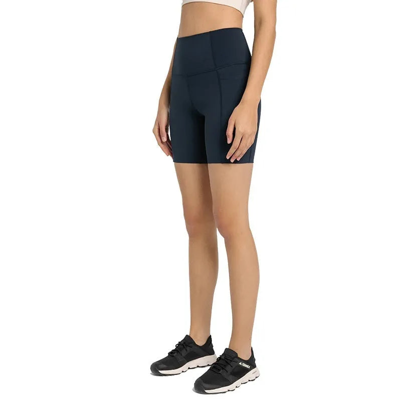 Women's tight-fitting mid-length sports shorts in a cotton blend fabric for running and fitness.