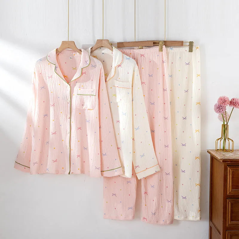 Women's thin cotton long-sleeve pajama set in pink, showing top and trousers.