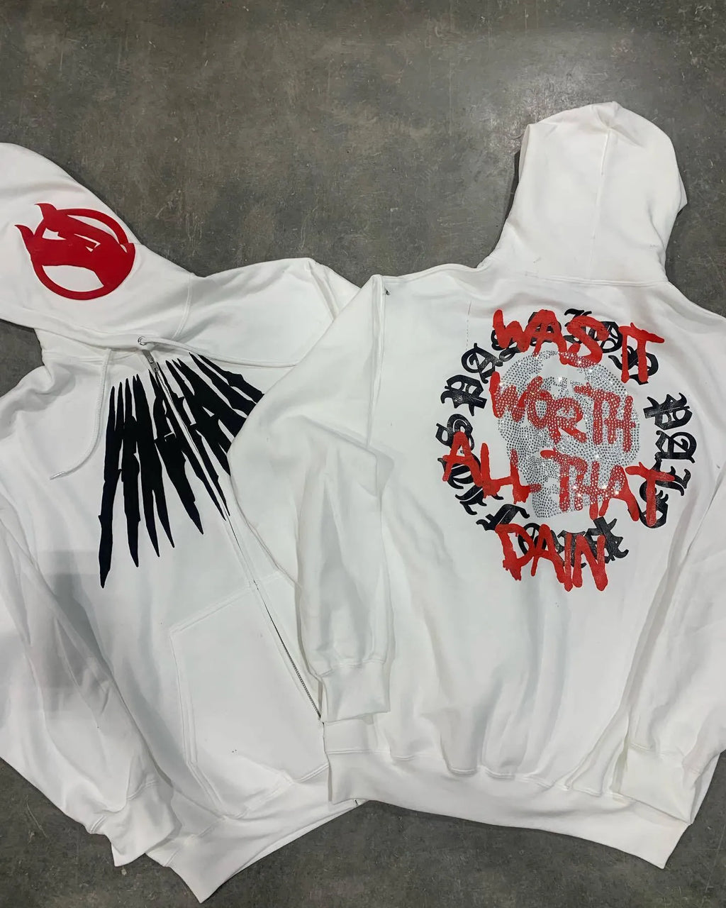 Black loose hooded sweatshirt with white skull letter pattern and hot rhinestone details on front