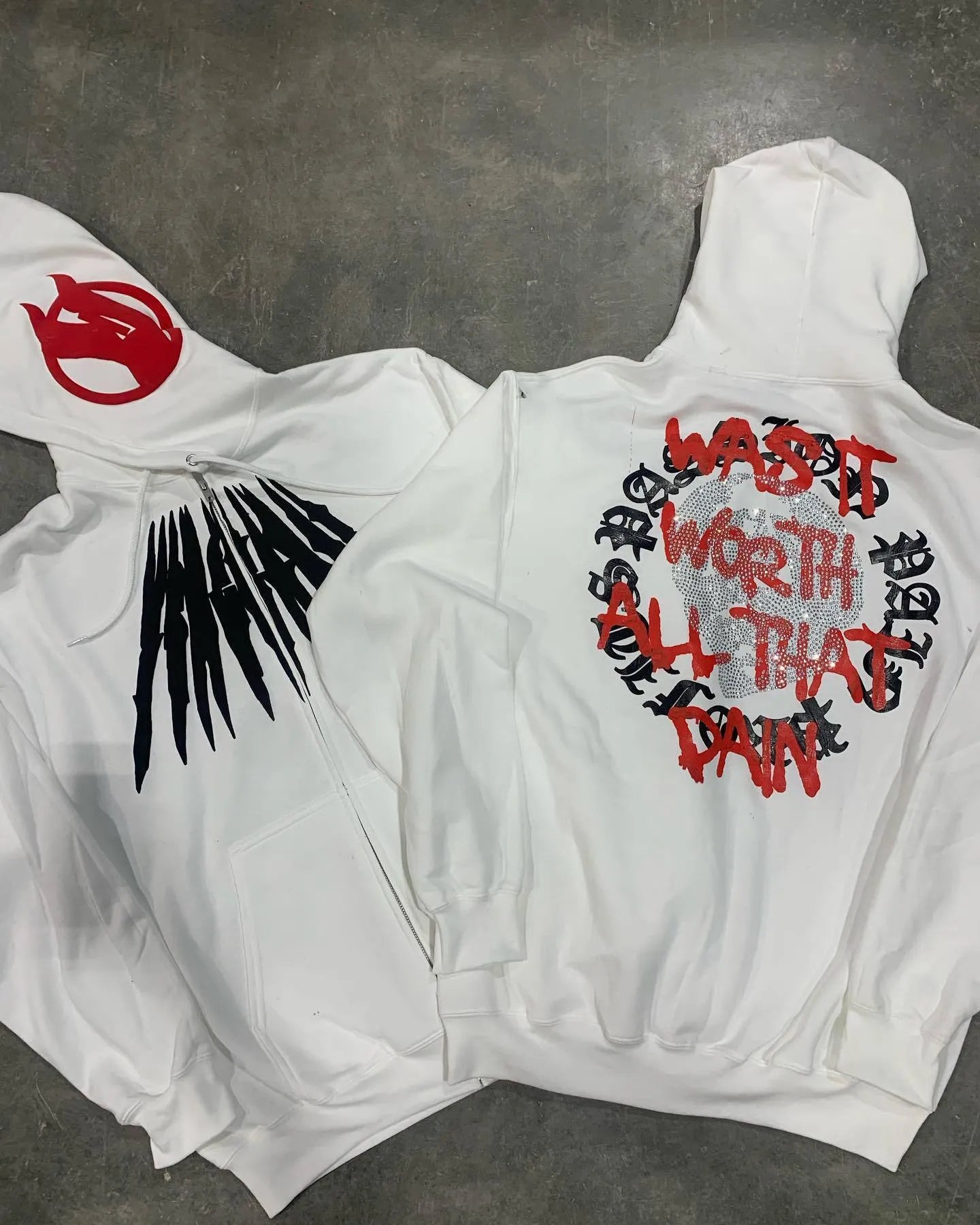 Black loose hooded sweatshirt with white skull letter pattern and hot rhinestone details on front