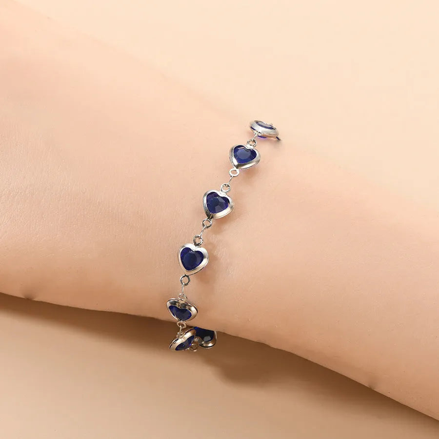 Devil's Eye Creative stainless steel geometric heart bracelet in an electroplated colour on a wrist.