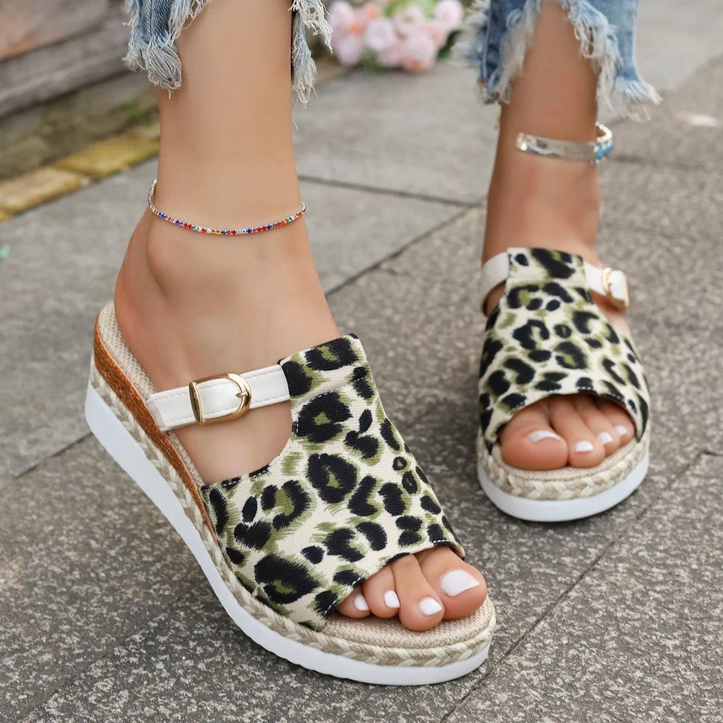 Leopard print wedge platform sandal with a fish mouth open toe on a rubber sole.