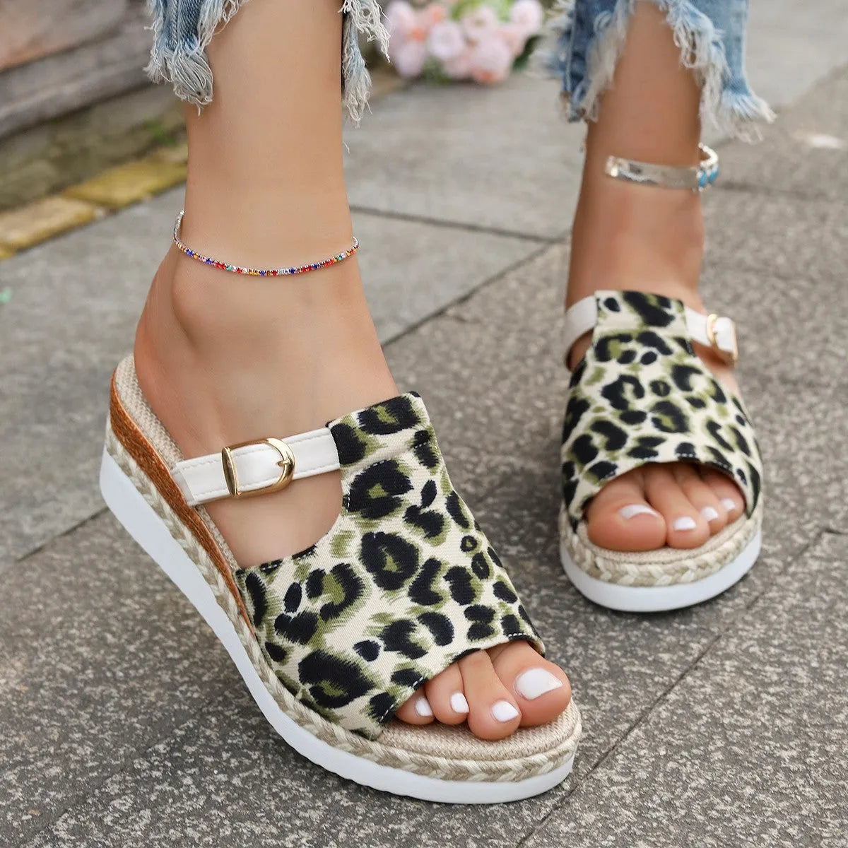 Leopard print wedge platform sandal with a fish mouth open toe on a rubber sole.