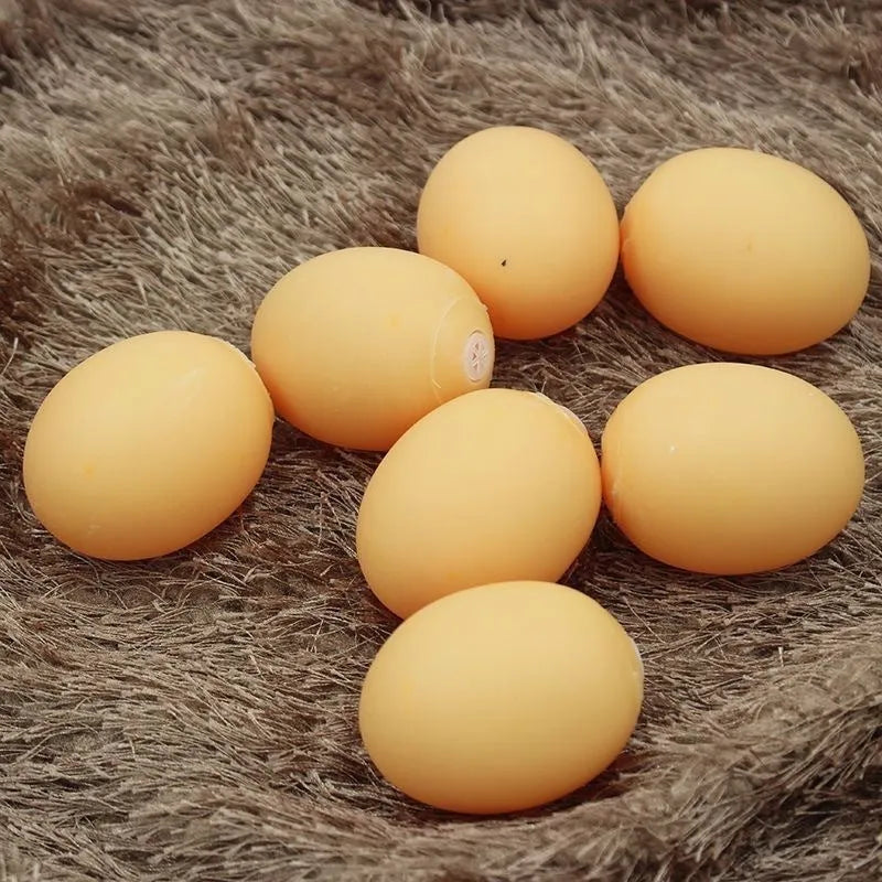 White plastic egg-shaped dog toy with textured surface for tooth cleaning and sound features