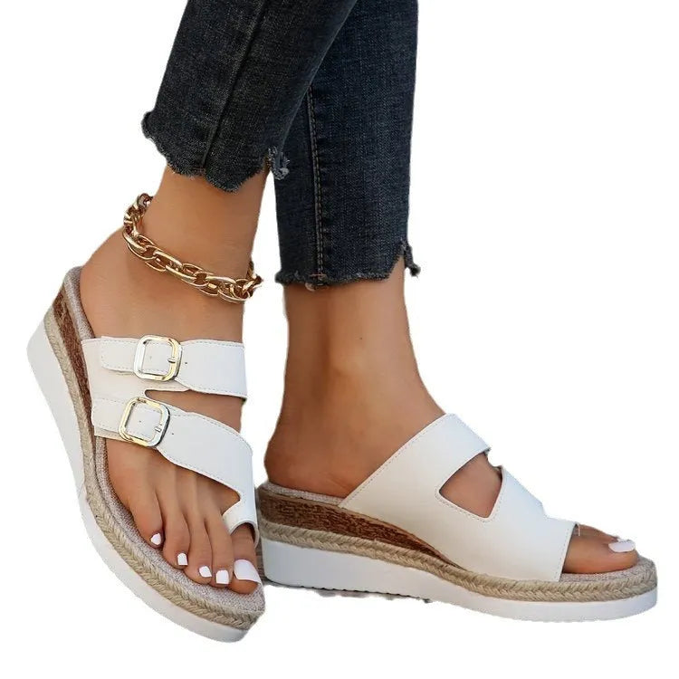 White patent leather wedge sandals with woven design and finger fit straps