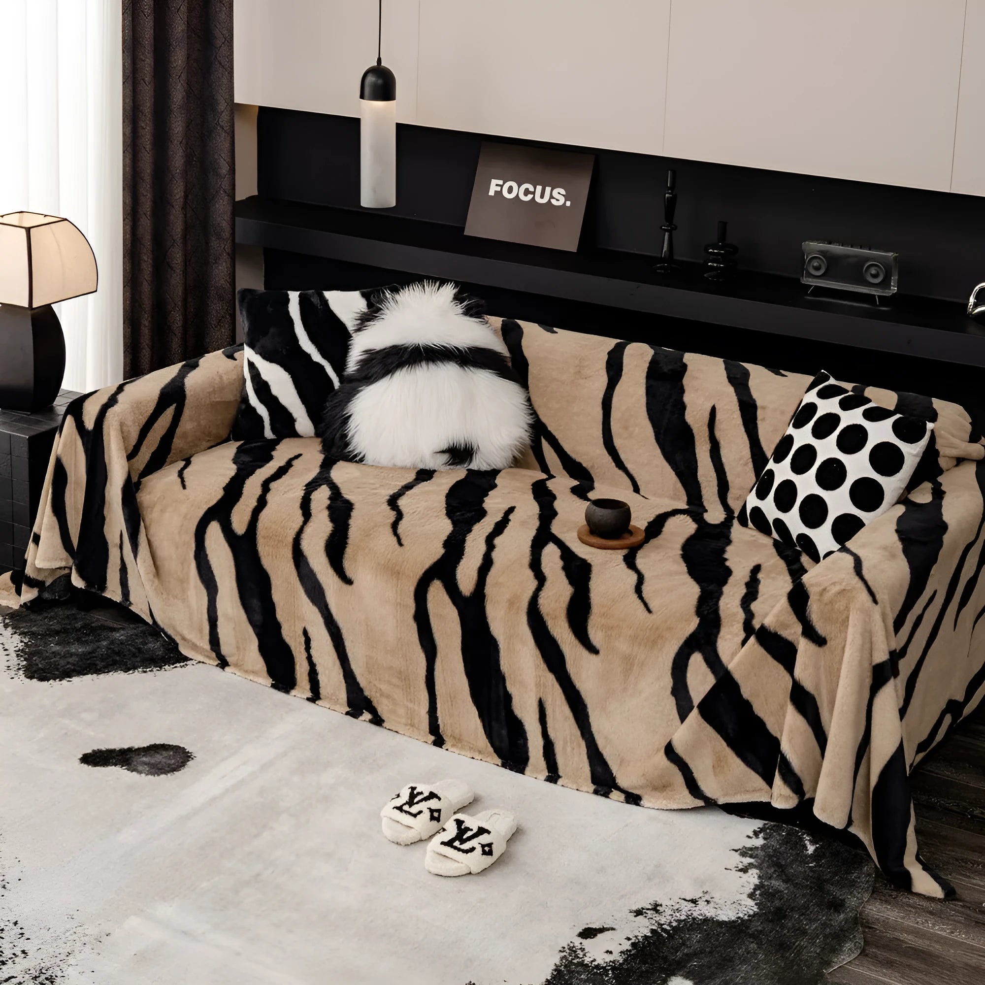 Zebra pattern flannel sofa cover with non-slip backing shown in a caramel colour.