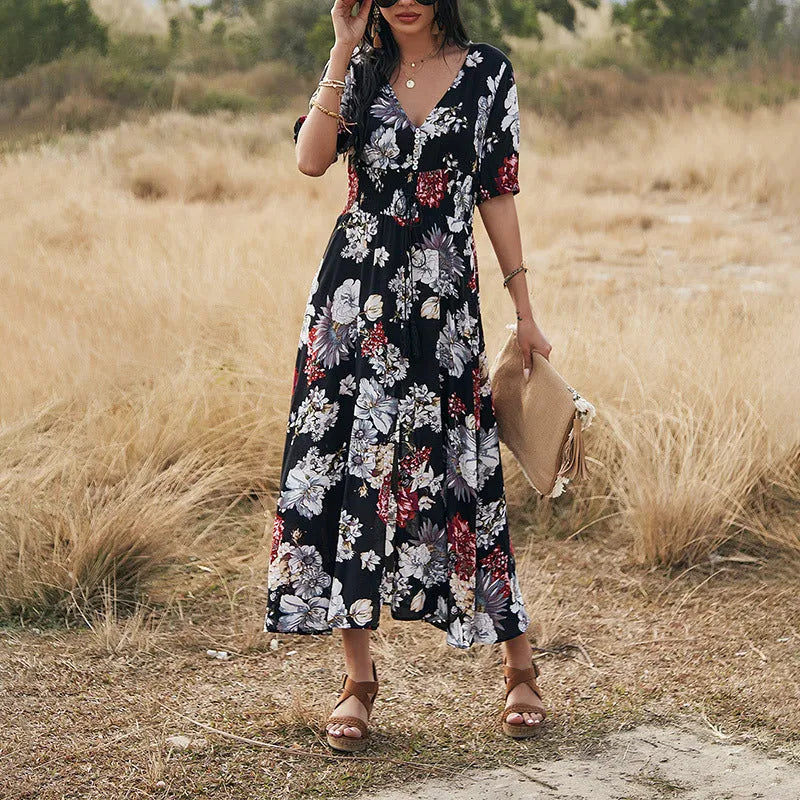 Yellow floral print women's summer dress with V-neck, short sleeves, and elasticated waist.