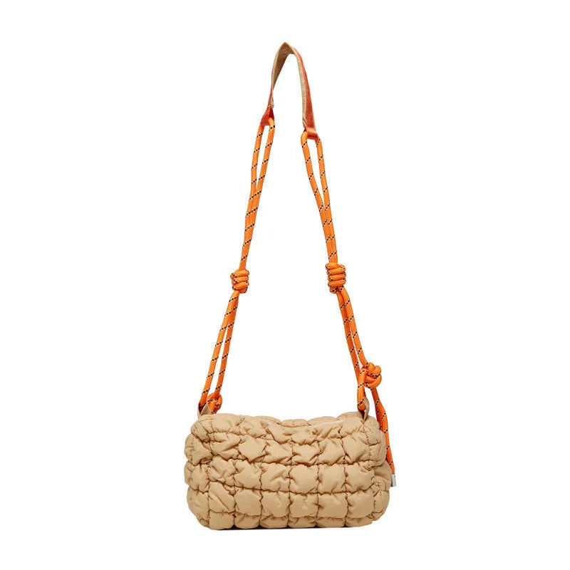Women's soft nylon pillow-shaped messenger bag with diamond quilting and a crossbody strap.