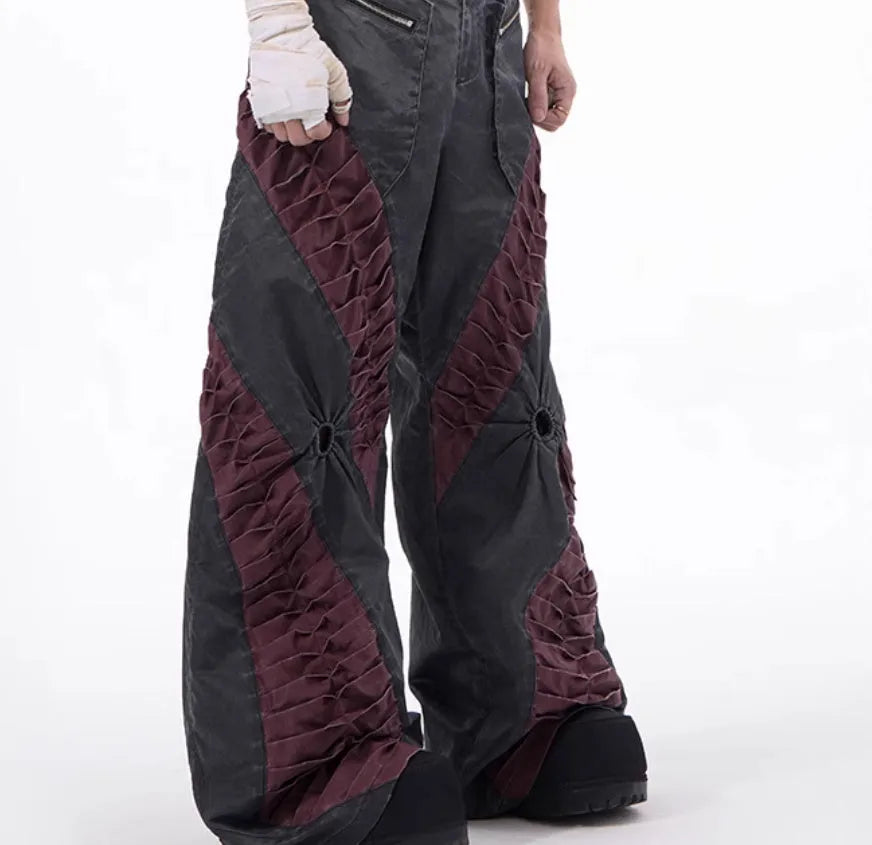 Men's slim-fit grey trousers with textured keel detailing on the legs.