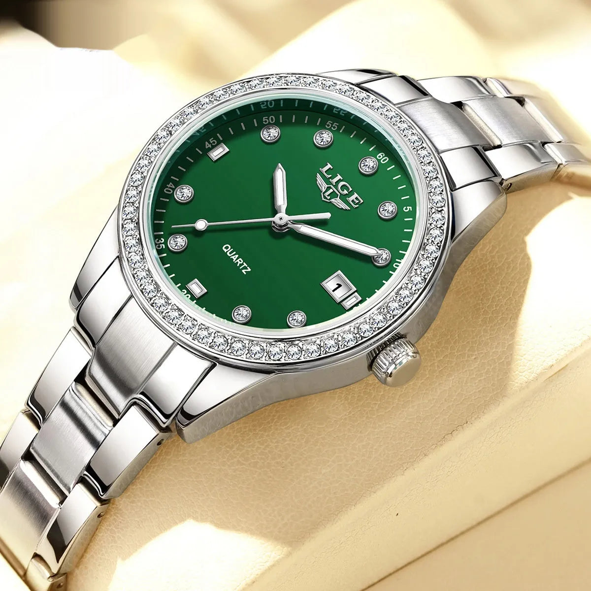 Women's silver-tone fashion watch with diamond bezel, round 34mm dial and luminous hands