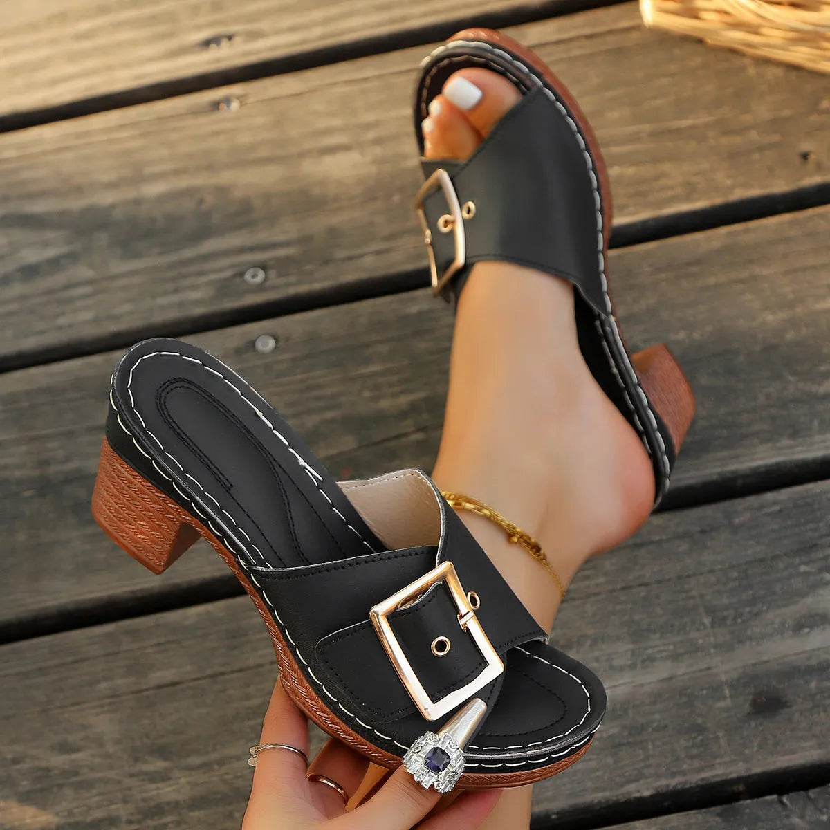 Women's black and light blue chunky heel slippers with metal buckle detail and round toe