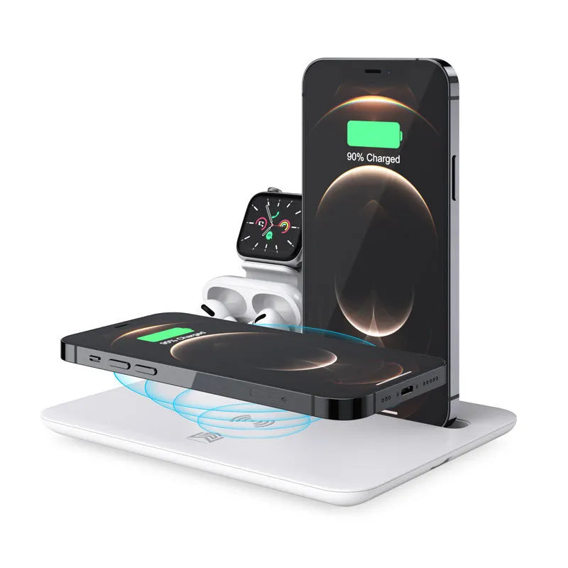 Black wireless charging desk bracket with phone on Qi pad, watch and headphones connected to wired charging ports