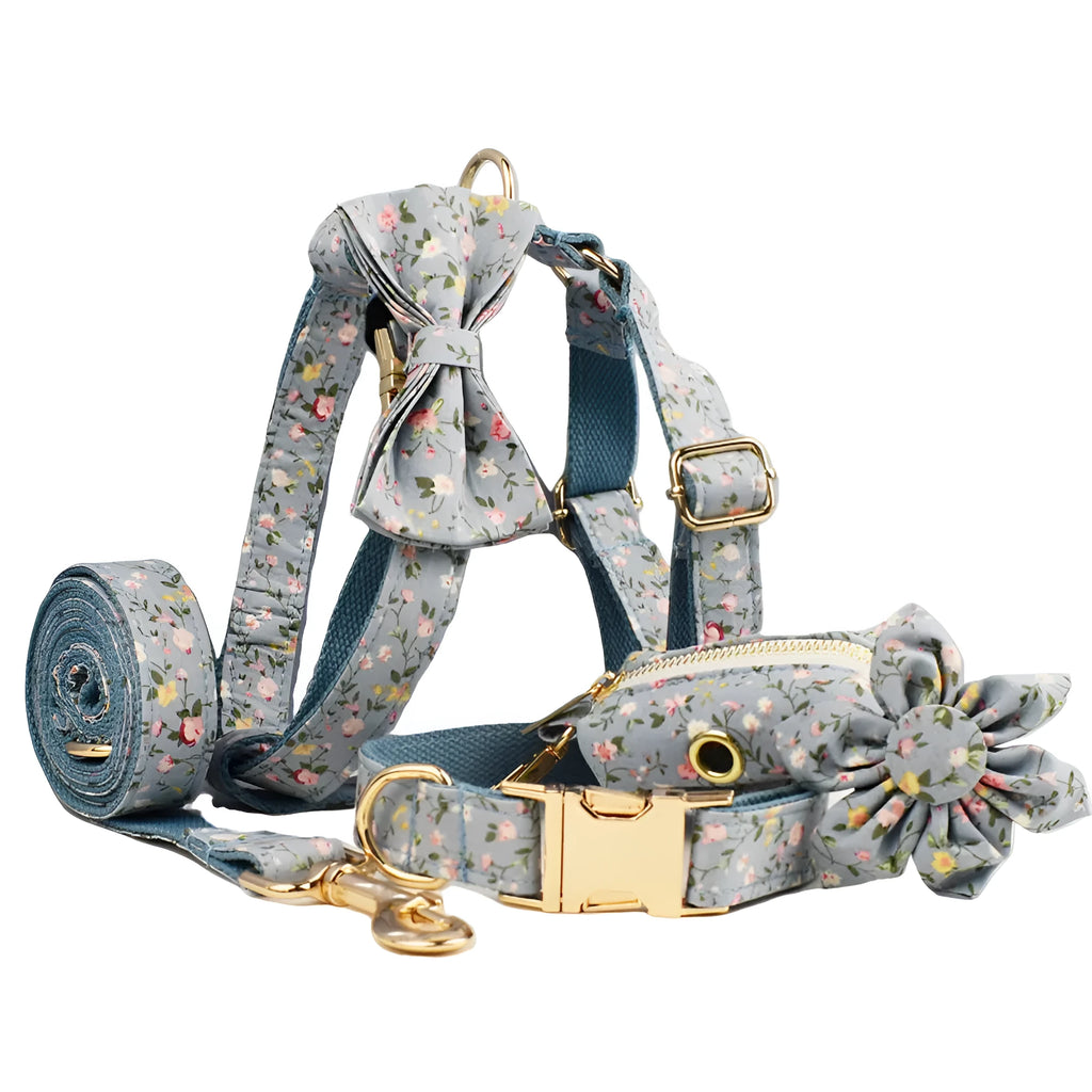 Blue floral polyester cotton dog collar set with matching leash, vest, poop bag, and decorative bow