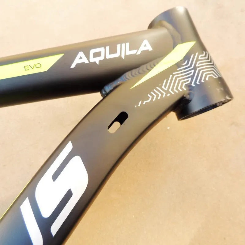 Black and green aluminium mountain bike frame with internal cable routing and disc brake mounts