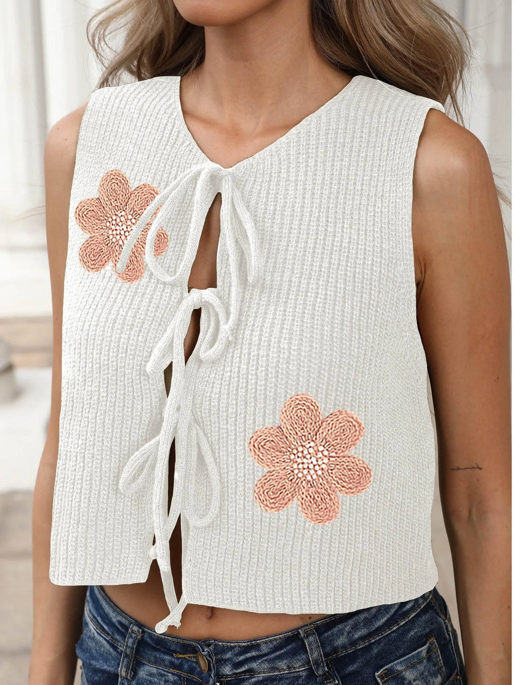 Ladies sleeveless cardigan vest with lace-up bow detail and floral embroidery
