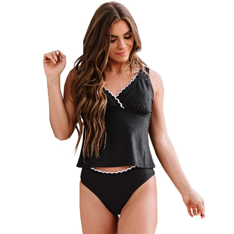 Black sleeveless one-piece split swimsuit for women on a mannequin