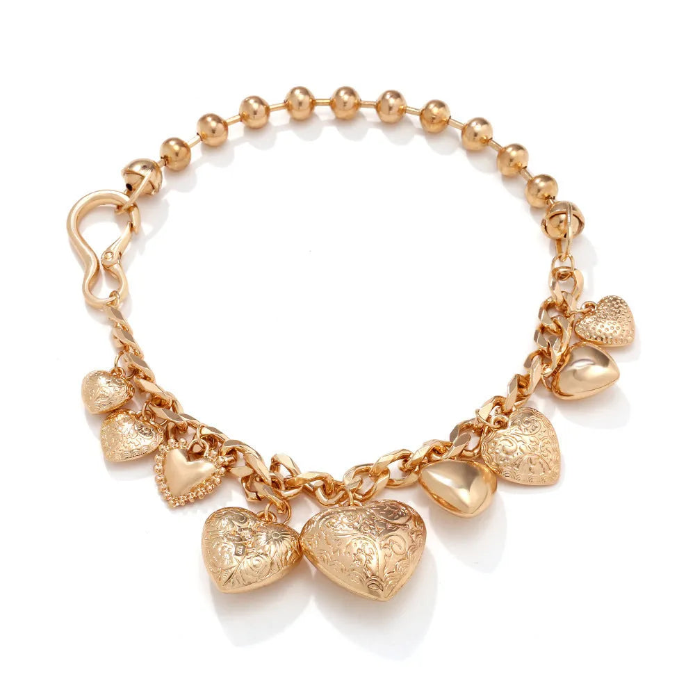 Exaggerated carved heart pendant necklace in gold finish with adjustable chain