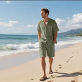 Men's linen blend short sleeve shirt and matching shorts set in light blue, laid flat.