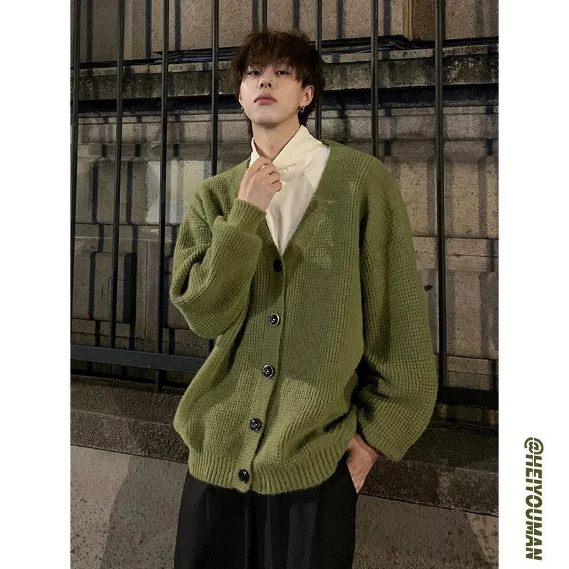 Men's loose fit V-neck cotton blend cardigan in Army Green, shown on a model.