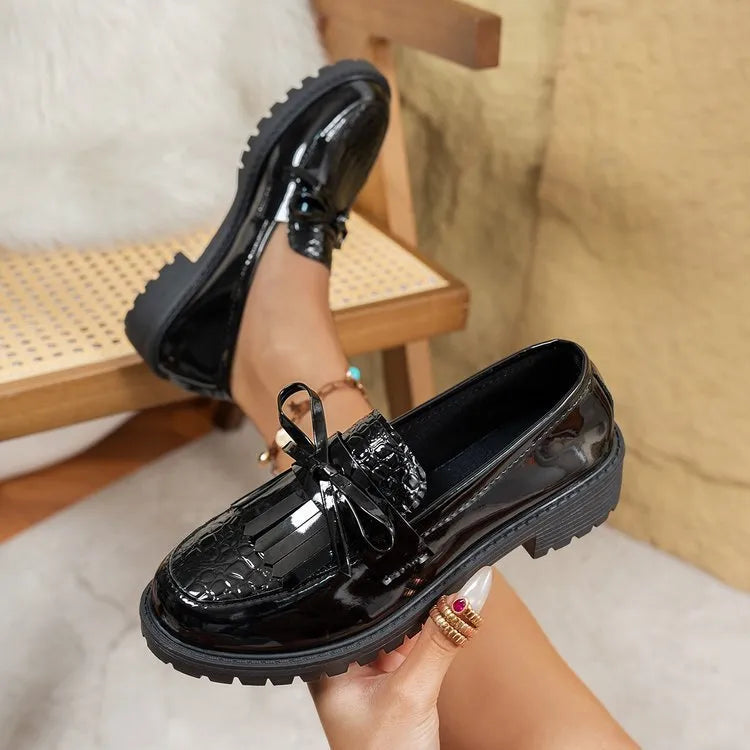 Women's black loafers with decorative bow detail for spring and autumn seasons