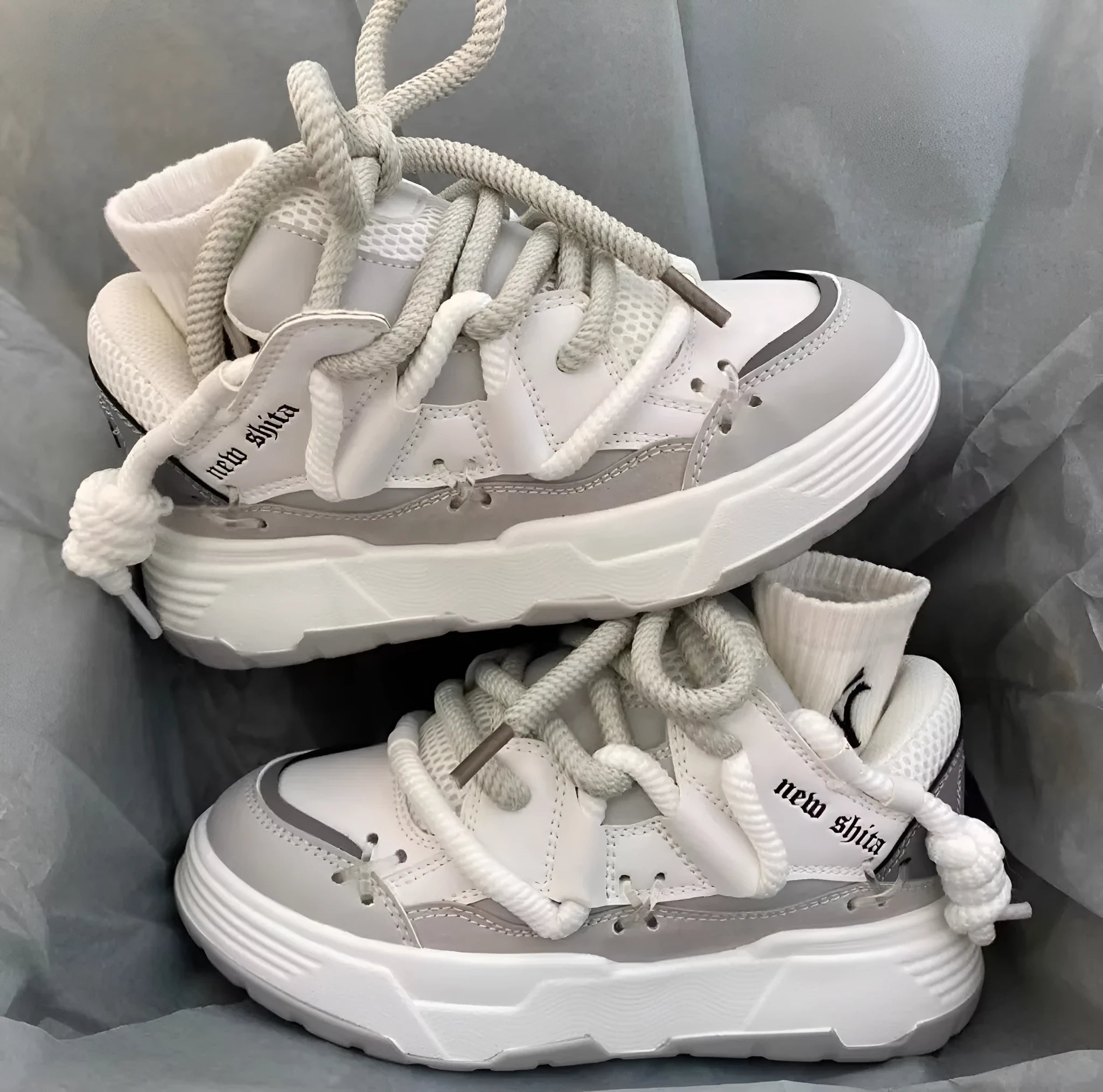 Women's grey retro chunky sneakers with a thick rubber sole and flat 6-8 cm heel.