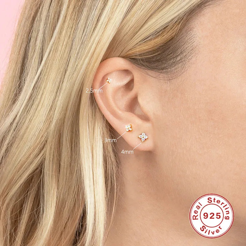 S925 sterling silver stud earrings with a geometric petal crystal flower in gold or platinum finish.