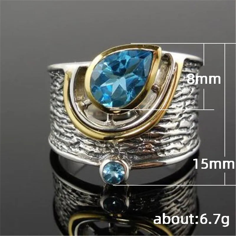 Women's blue zircon ring with Chinese style design and drop shape, shown in alloy.