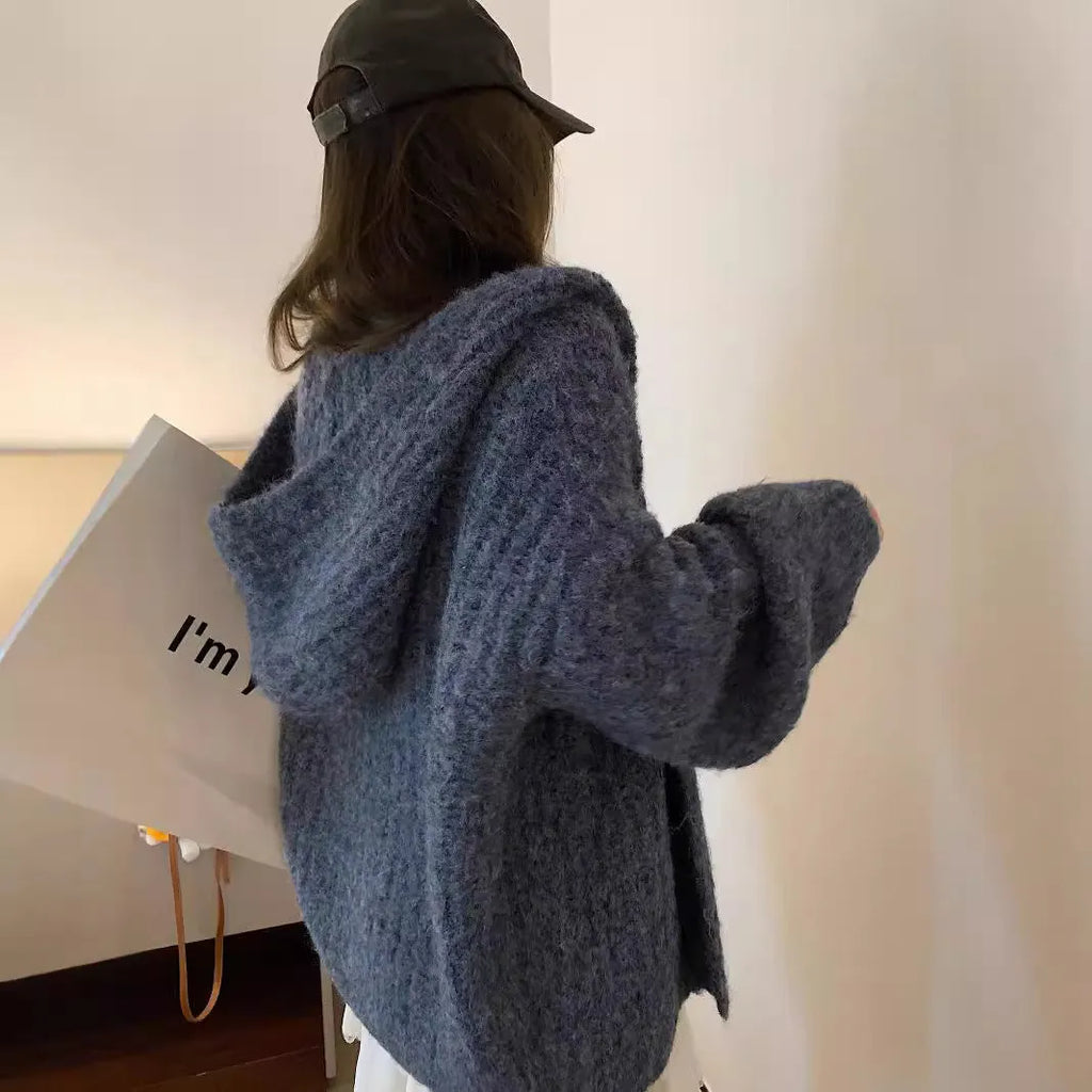 Women's loose-fit hooded cardigan in thick fabric, shown in dark grey, brown, and milky white colours.